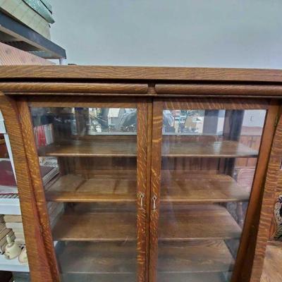 2005: Antique Tiger Oak Cabinet w/ 4 Shelves on Wheels
Cabinet measures approx. 17" x 49" x 65.5"
