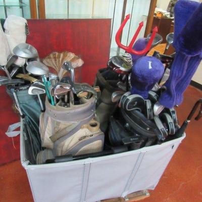 Cart of golf clubs. Some compltete sets