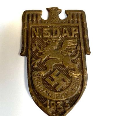 A 1933 NSDAP POMMERN DISTRIT COUNCIL DAY BADGE
A 1933 NSDAP Gautag Pommern badge in bronze, vertical pinback, unmarked, measures approx...