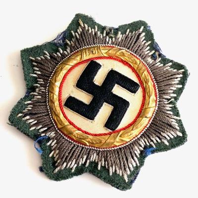 GERMANY, A WEHRMACHT (HEER) ISSUE GERMAN CROSS IN GOLD,
(Deutsches Kreuz in Gold, Stoffausfuhrung) Hand Embroidered featuring a...