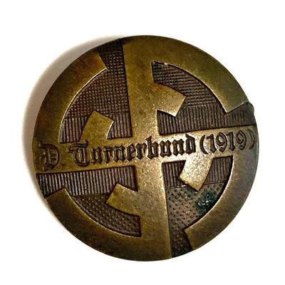 A 1919 GERMAN GYMNASTICS ASSOCIATION MEMBERSHIP BADGE
A 1919 Deutscher Turnerbund membership badge in bronze, horizontal pinback. Maker...