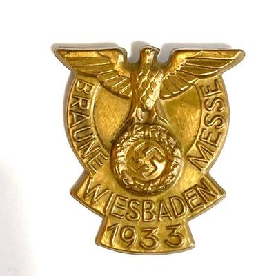 A 1933 WIESBADEN NATIONAL SOCIALIST EXHIBITION BADGE
A 1933 Wiesbaden Braune Messe badge, in bronze with horizontal pinback, unmarked,...