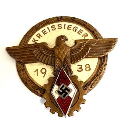 GERMAN, A 1938 HJ VICTORA 1938 Kreissieger badge, a cream colored enameled badge , with a national eagle superimposed on the obverse...