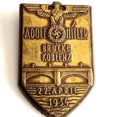 A 1934 OPENING OF THE A.H. BRIDGE IN KOBLENZ BADGE
A 1934 A.H. Brucken Koblenz Badge (22.4.1934) in bronze, horizontal pinback, unmarked...