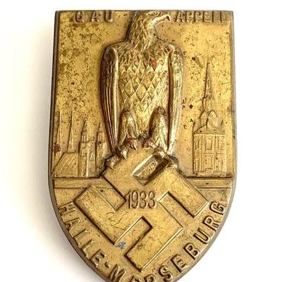1933 GERMAN WWII GAU HALLE-MERSEBURG TINNIE BADGE
Original era manufacture. Attractive gilded brass shield-shaped tinnie with a pinback...