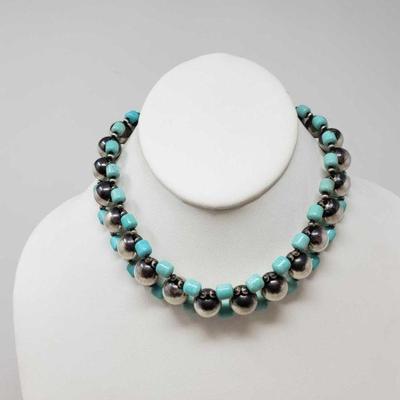 104: Native American Choker with Turquoise and Navajo Beads, 55.7
This native American Turquoise choker with Navajo Beeds weighs...