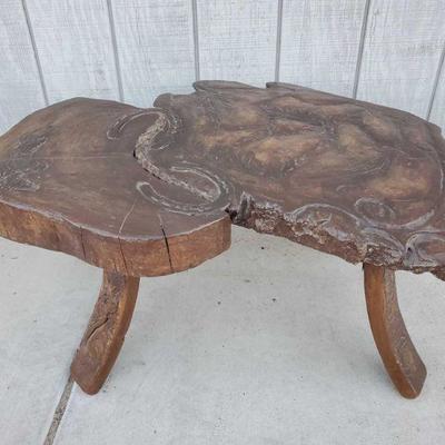 3703: "Round Horses" By Cliff Larson Carved Wood Table
Measures approx. 33" x 24" x 14"