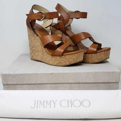 510: BRAND NEW AUTHENTIC Jimmy Choo Aleili Plateform Wedge Sandal Size 39/8
Meticulously crafted in a braided design from cuoio vachetta...