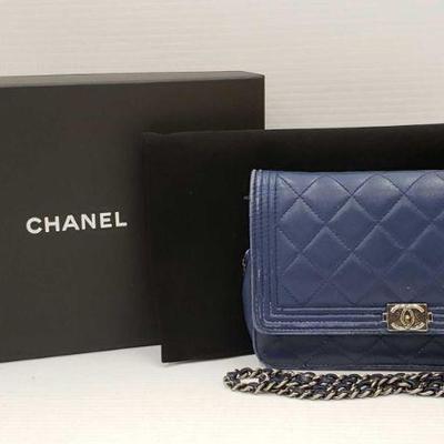 346: Authentic Chanel Mini Bag with Original tags and box
**Authenticated** Dark Blue Mini Chanel Bag Value $2,100.00 Comes with Original...