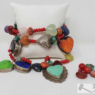 Beautiful Sterling Silver Charm Bracelet with Coral, Turquoise, Black Onyx to name a few
Sterling Silver Bracelet