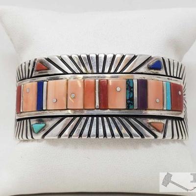 Sterling Silver Turquoise, Oyster, Coral in a Channel Setting Cuff Bracelet. Weighs Approx 106.7g
Value $500.00-$750.00
Sterling Silver...