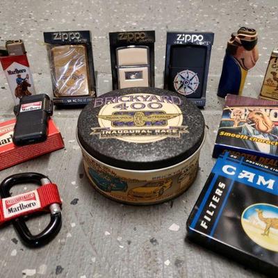 5541: Zippo Lighters and Specialty Cigarette Collectibles
Marlboro lighters and carabiner. Camel lighters, tin, and playing cards. Zippo...
