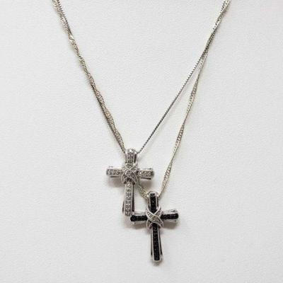 2 Silver Diamond Cross Necklaces, 6.9
These two necklaces together weigh approximately 6.9g and are marked silver
