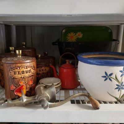 Kitchen Storage and Wares
Meat grinder, pans, labeled jars, bowls.