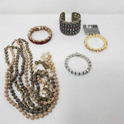 Associated Costume Jewelry
Includes a Necklace, and Bracelets