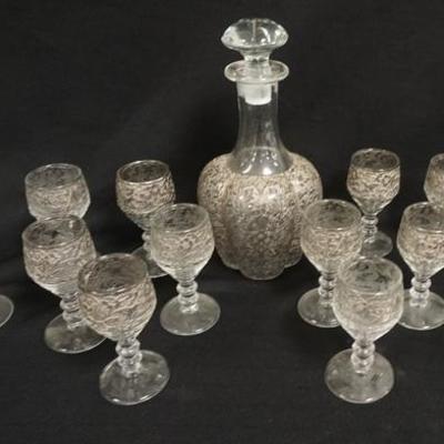 1023  FLORAL ETCHED DECANTER WITH 12 MATCHING STEMS. ORIGINAL STOPPER. DECANTER IS 10 IN H
