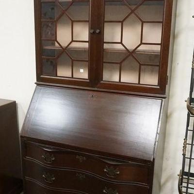 1241  MAHOGANY SECRETARY W/ BOOKCASE TOP, HAS SERPENTINE DRAWER FRONTS & BALL & CLAW FEET 
