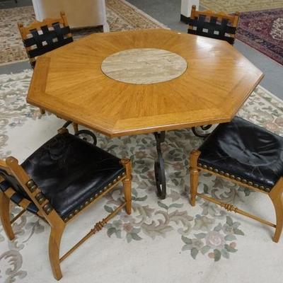 1039  HERITAGE OCTAGONAL GAME TABLE WITH INSET MARBLE CENTER  IRON BASE WITH 4 CHAIRS WITH WOVEN LEATHER STRAP BACKS. 
