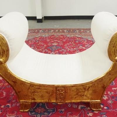 1064  CARVED GILT UPHOLSTERED BENCH. SOME SMUDGES ON THE UPHOLSTERY
