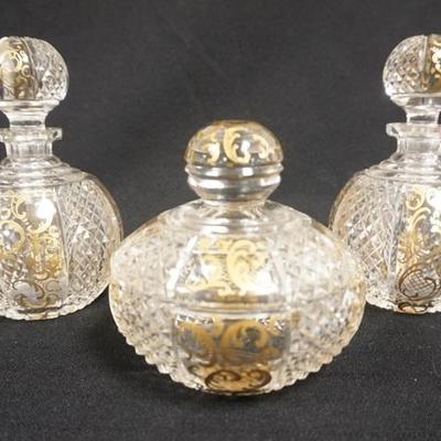 1056  3 PC CRYSTAL WITH GOLD DECORATION DRESSER SET. 2 PERFUMES AND A POWDER BOX SIGNED *CHECO-SLOVAQUIE*. PERFUMES ARE 6 IN HIGH
