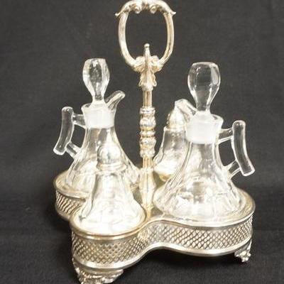 1068  4 PC CRUET SALT AND PEPPER SET IN THE ORIGINAL SILVER PLATED HOLDER. SHAKERS HAVE STERLING SILVER TOPS, CRUETS HAVE ORIGINAL...