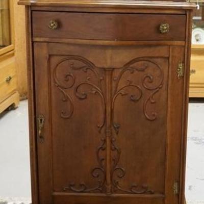 1239  CARVED MIRROR BACK MUSIC CABINET, HAS A DRAWER BEVELED MIRROR & A BRASS GALLERY W/ WINGED GRIFFINS 
