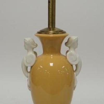 1253  DAV ART , NY PORCELAIN & BRASS LAMP HAS FIGURAL HANDLES POSSIBLY LENOX PORCELAIN, NEEDS TO BE WIRED, PORCELAIN IS 11 IN H 
