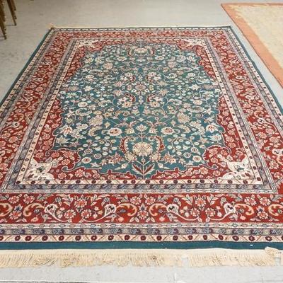 1050  ROOM SIZE ORIENTAL RUG, GREEN WITH RED. 10 FT 6 IN X 7 FT 9 IN
