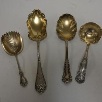 1270  FOUR STERLING SILVER SERVING SPOONS W/ GOLD WASH BOWLS, LONGEST IS 9 IN, 6.28 OZT
