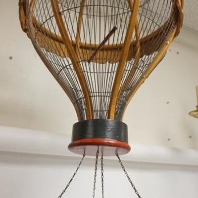 1073  WOODEN HANGING BIRD CAGE IN THE FORM OF A HOT AIR BALLOON. APP 39 IN H

