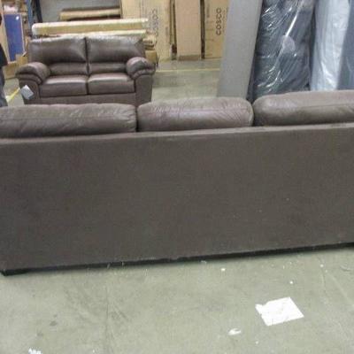 Brown Sofa....has shipping damage on one side along the bottom and on one edge..