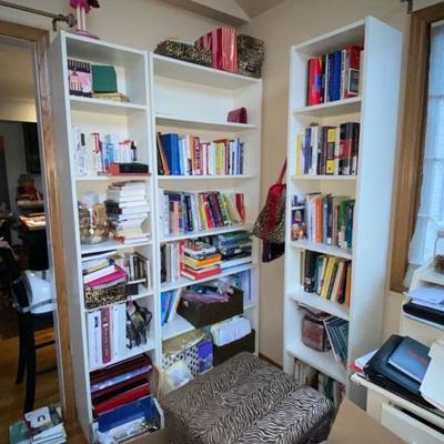 White book cabinet and books