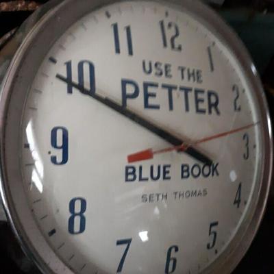 Letter blue book wall clock