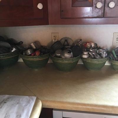Green pottery bowls & early cookie cutters 