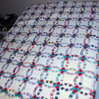 Double wedding ring quilt, one of three