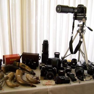 
vintage cameras and powder horns