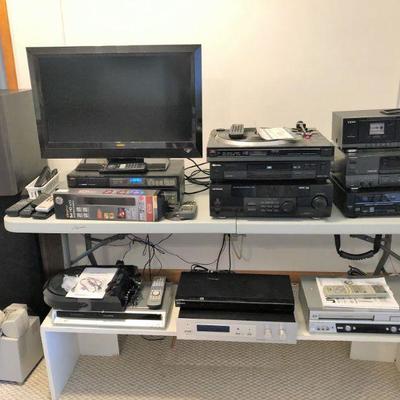 Numerous electronics - turntable  - flatscreen - receivers - DVD players - VCR players - and more
