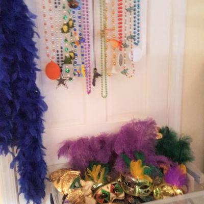 mardi gras beads, masks, boa