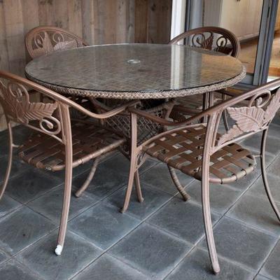 Wicker patio table and 4 Agio patio chairs