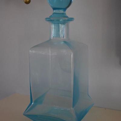 One of a pair of decorative glass bottles
