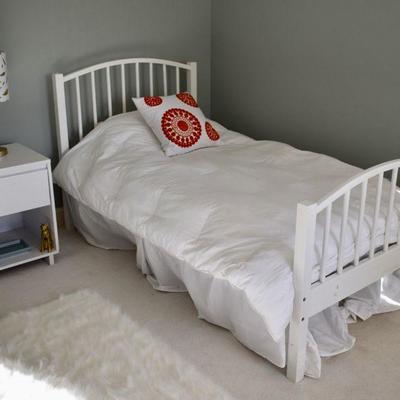 White twin bed and matching nightstand
