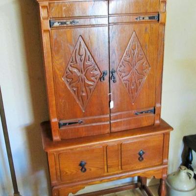 Antique exotic 2-door hutch with lots of charm.