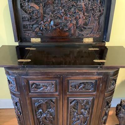 Carved rosewood Chinese liquor cabinet depicting a court scene. Carved on outside and inside the lid. Approximate 28