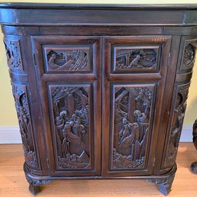Carved rosewood Chinese liquor cabinet depicting a court scene. Carved on outside and inside the lid. Approximate 28