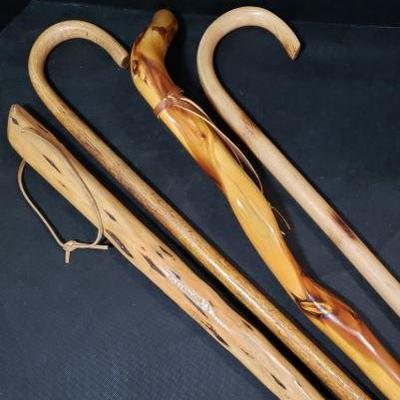 Four Wood Canes. One Canes measures L 36 inches and W 2 inches. Knotty Pine Cane measures L 37 inches and Handle W 7 inches. Wood Cane...