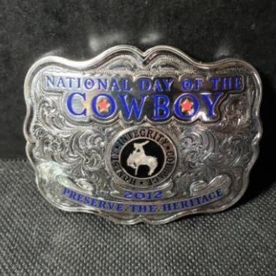 Solid Bronze National Day of the Cowboy 2012 Preserve the Heritage Belt Buckle measures Length 3 1/2 inches and Height 2 3/4 inches....