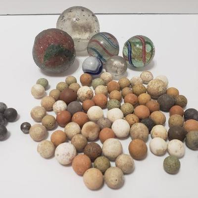 Handmade clay marbles and steel marbles from the 1880s. Large glass antique/vintage marbles, some with animal figures inside....