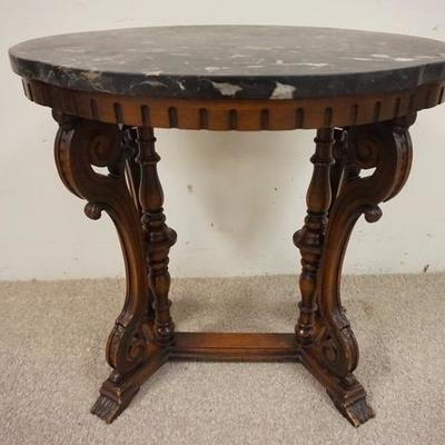 1049	OVAL MARBLE TOP CARVED WALNUT STAND W/ TURN COLUMNS & SCROLLED LEGS 
