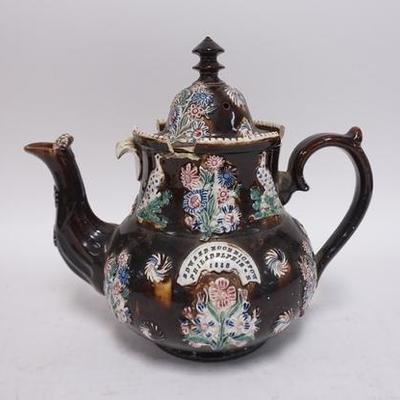 1198	LARGE ANTIQUE TEAPOT W/ HAND PAINTED RELIEF DECORATION OF BIRDS & FLOWERS HAS AN APPLIED MEDALLION APPEARS TO READ *EDWARD NOON N 10...