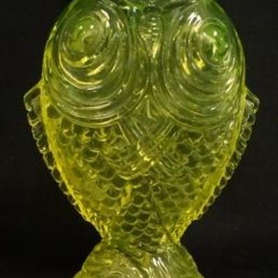1028	BACCARAT VASELINE DOUBLE CARP VASE BOTTOM & TOP RIMS ARE POLISHED & THERE IS A SMALL CHIP NEAR THE TOP OF THE FIN ON ONE SIDE, 6 IN H 
